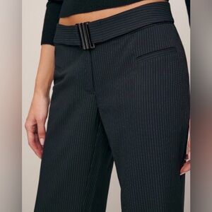 Reformation x Camille Rowe "Cherie" mid-rise pinstripe wide-leg trousers.
